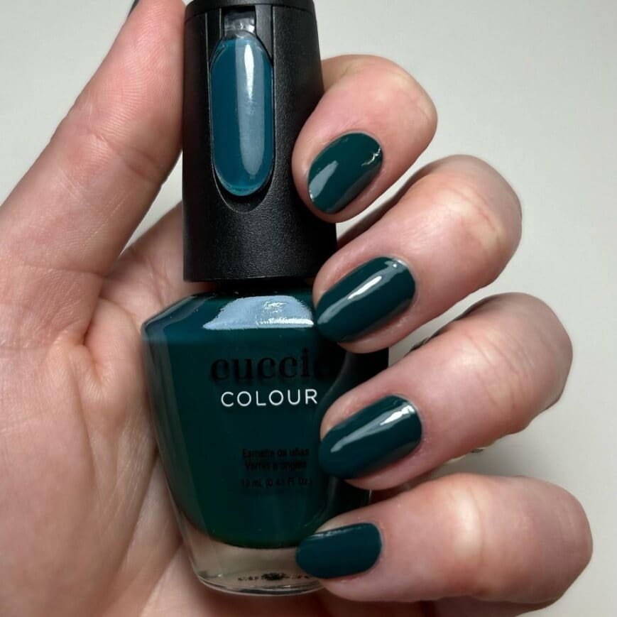 tickled-turquoise-lacquer-on-nails-with-bottle.jpg